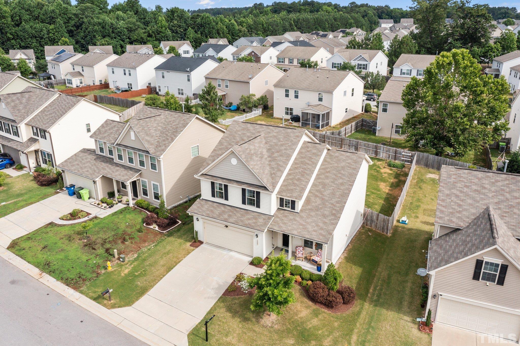 3229 Revelation Street Raleigh, NC 27610 - Photo 6 of 45 an aerial view of residential houses with outdoor space and parking