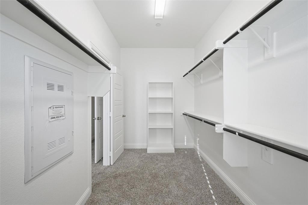 4624 Piedras Lanzar Drive McKinney, TX 75070 - Photo 11 of 20 a view of walk in closet with empty racks
