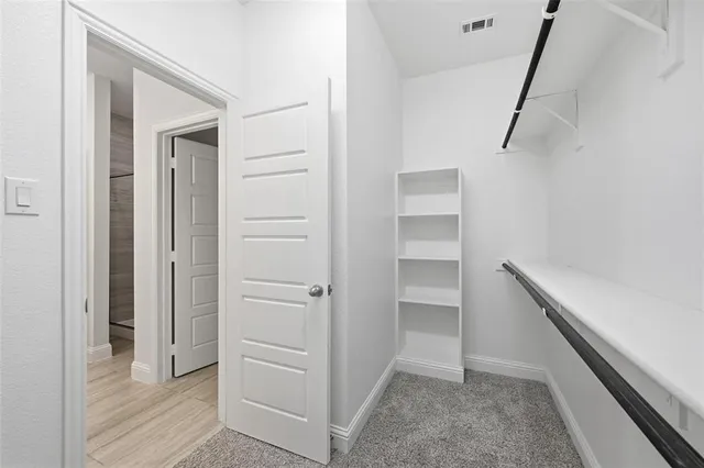 a view of an empty walk in closet