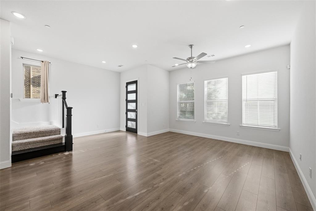 4624 Piedras Lanzar Drive McKinney, TX 75070 - Photo 3 of 20 wooden floor in an empty room with a window