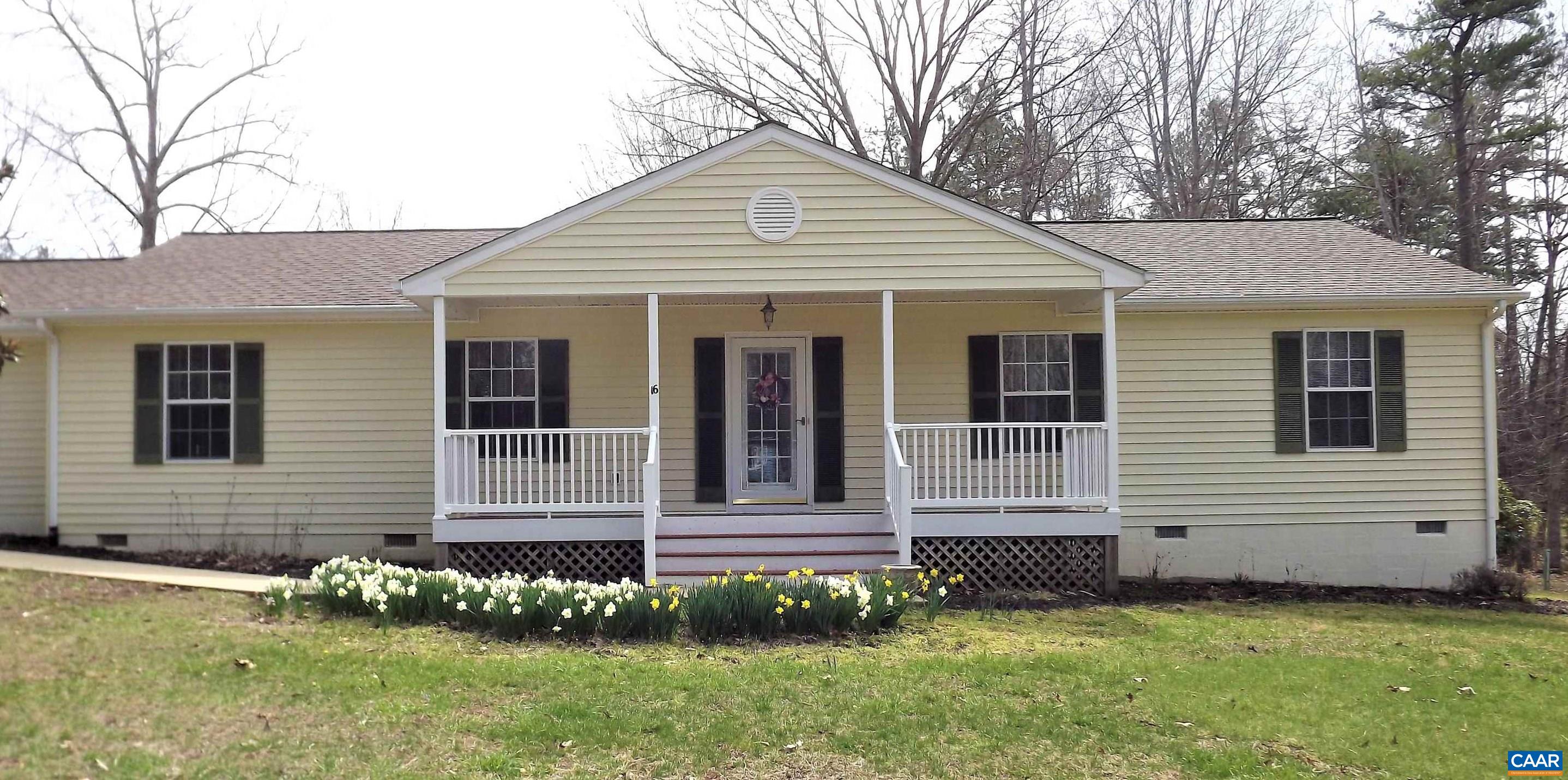 16 Powhatan Road Palmyra, VA 22963 - Photo 1 of 30 a front view of a house with a garden