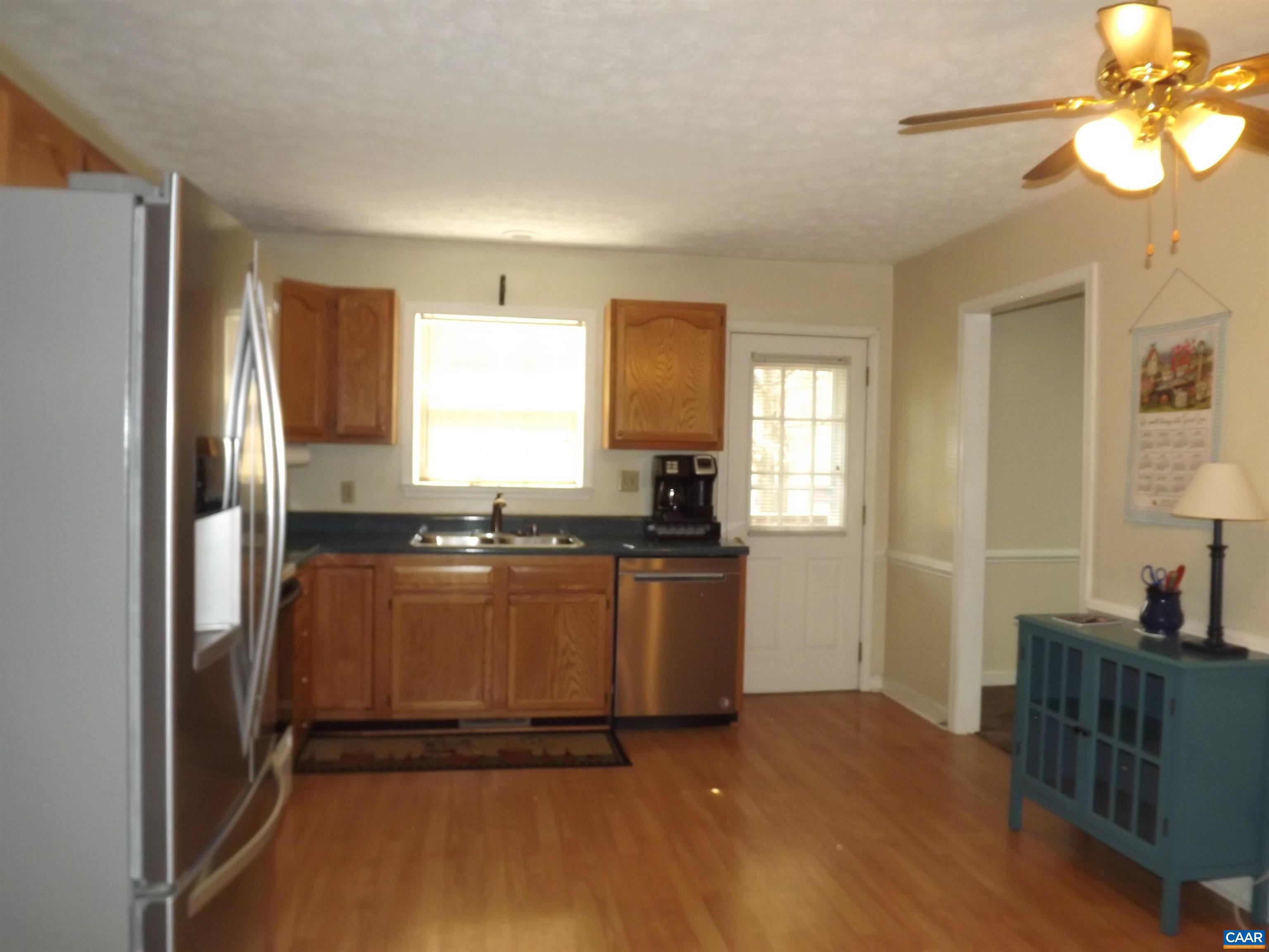 16 Powhatan Road Palmyra, VA 22963 - Photo 16 of 30 a kitchen with a refrigerator and a stove top oven