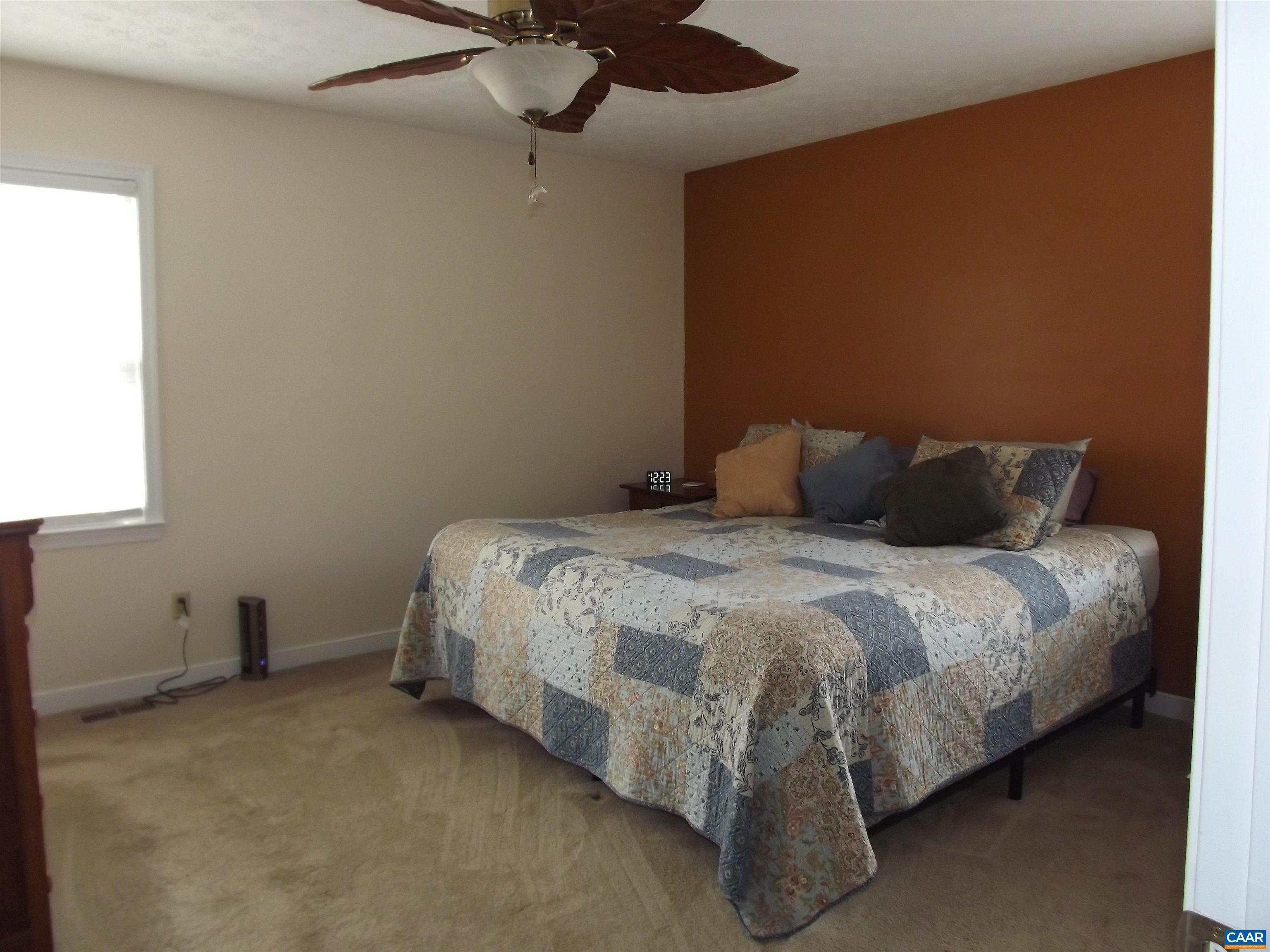 16 Powhatan Road Palmyra, VA 22963 - Photo 22 of 30 a bedroom with a bed and a ceiling fan