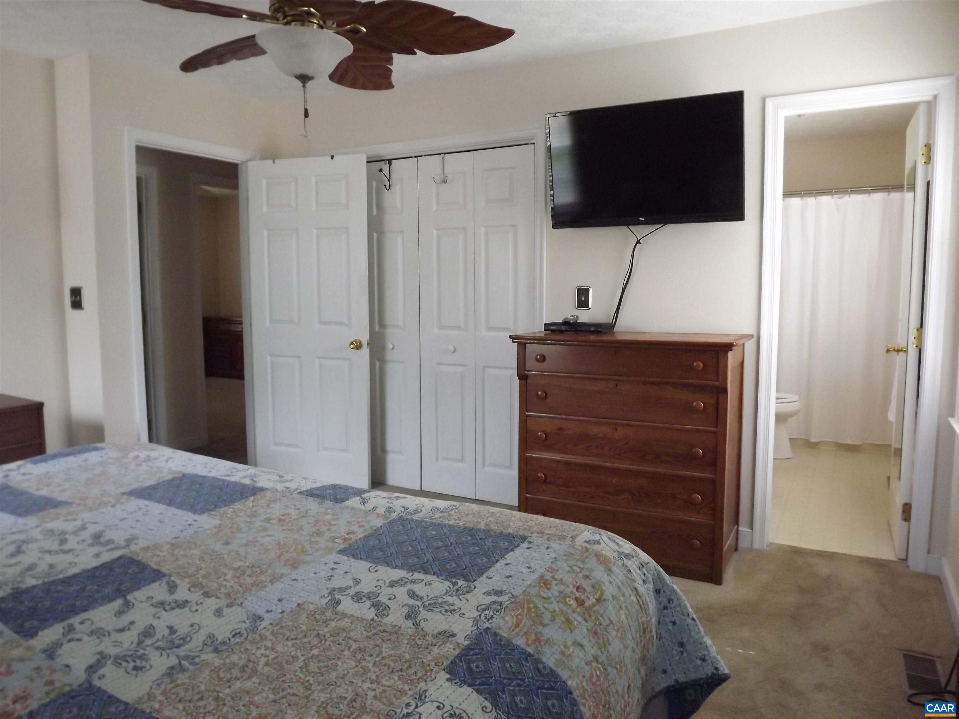 16 Powhatan Road Palmyra, VA 22963 - Photo 23 of 30 a bedroom with a bed and a flat screen tv
