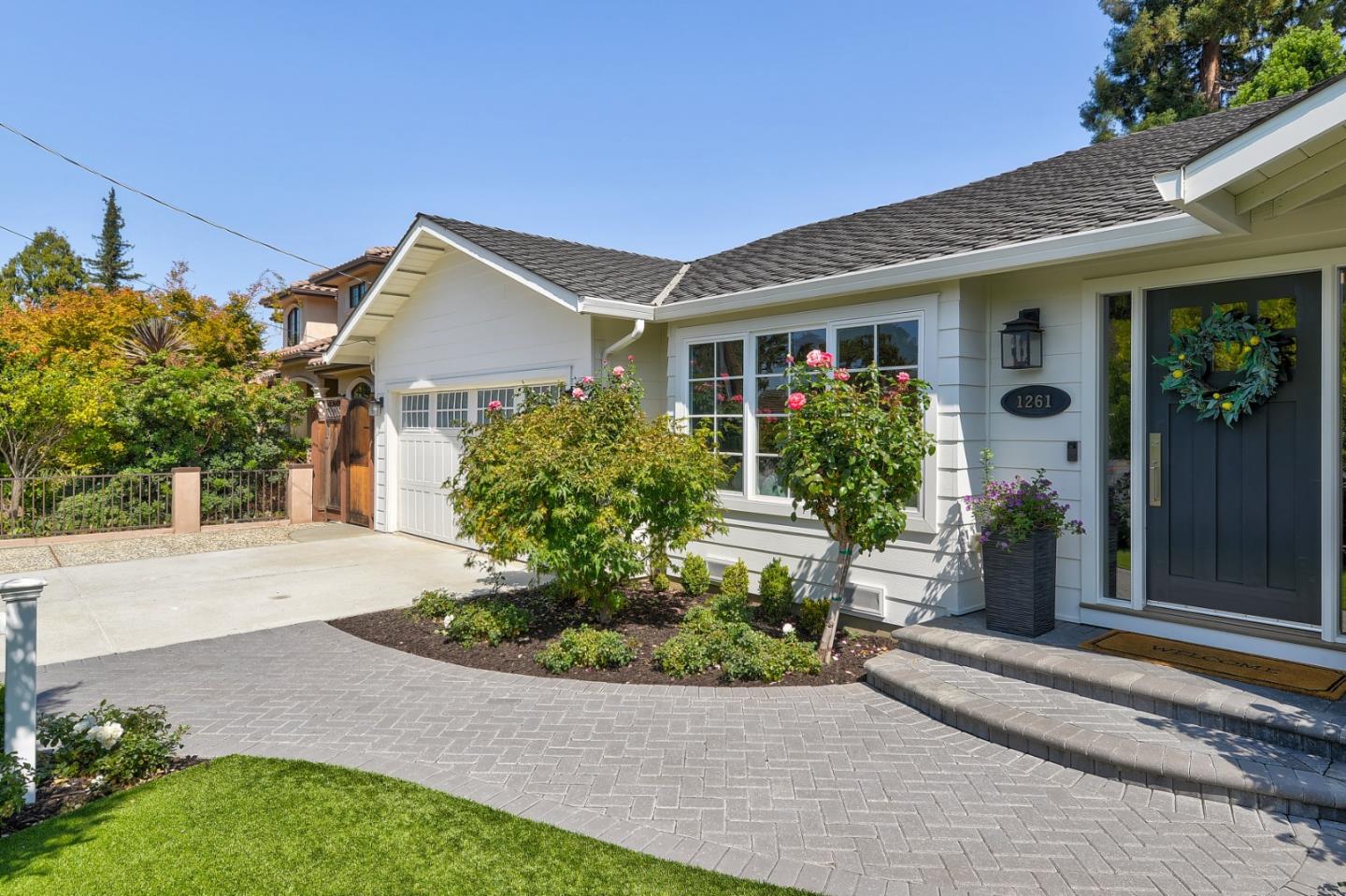 1261 Springer Road Los Altos, CA 94024 - Photo 2 of 32 a front view of a house with garden