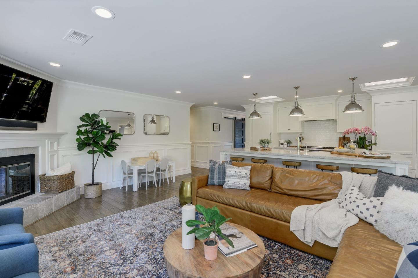 1261 Springer Road Los Altos, CA 94024 - Photo 13 of 32 a living room with furniture a fireplace and a flat screen tv