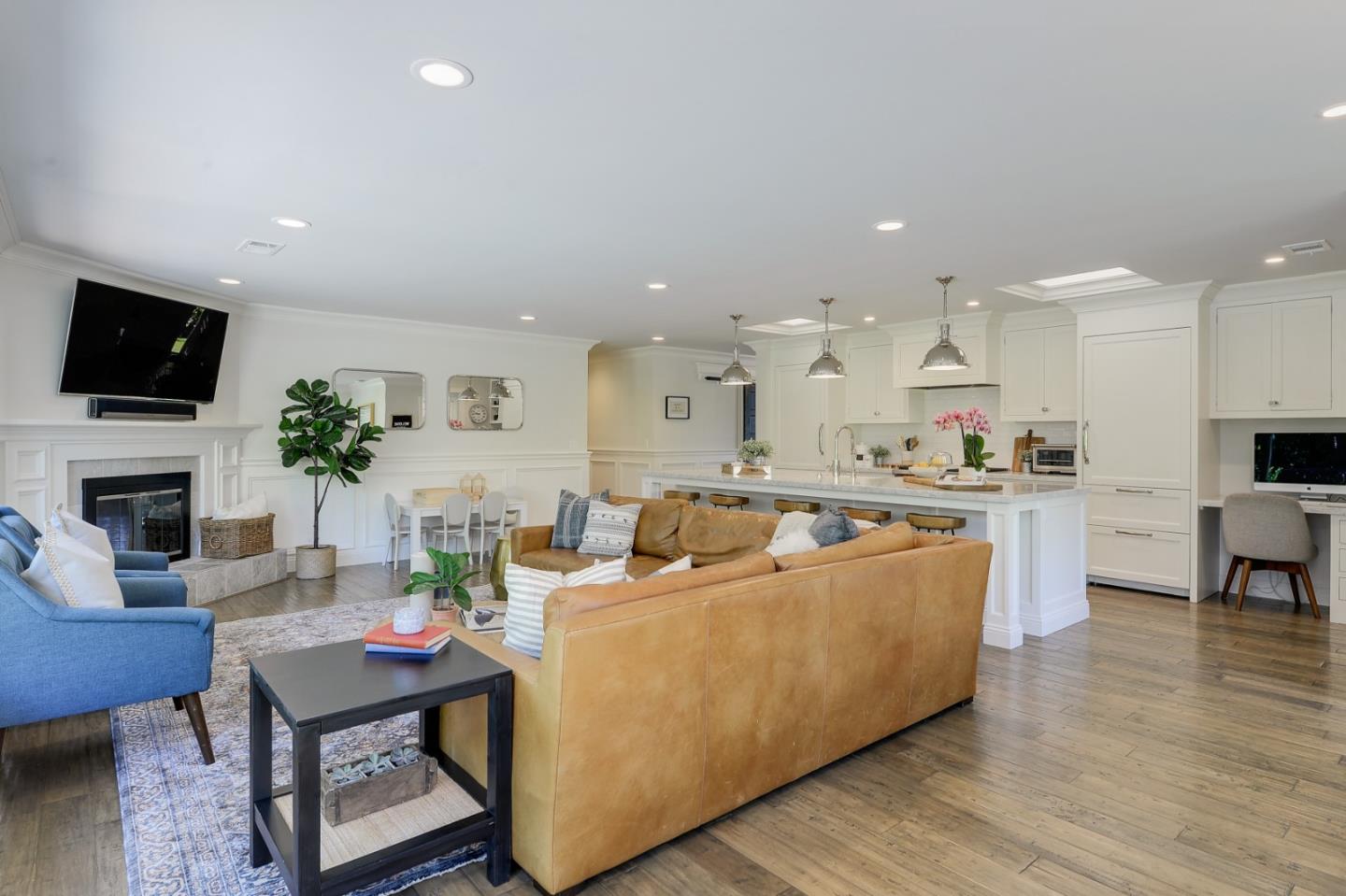 1261 Springer Road Los Altos, CA 94024 - Photo 17 of 32 a living room with furniture a flat screen tv and a fireplace
