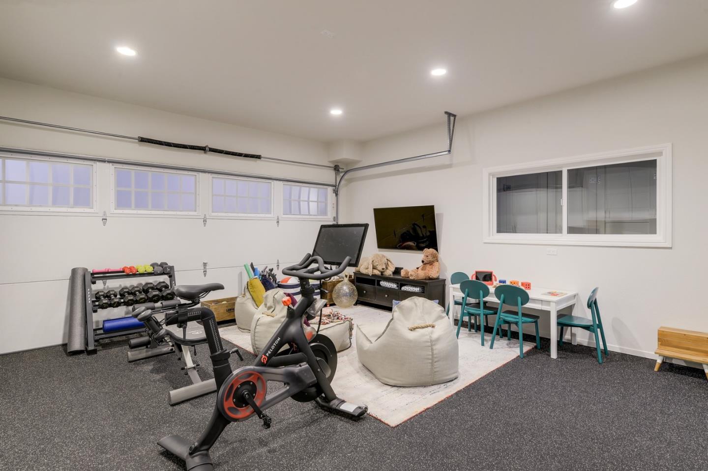 1261 Springer Road Los Altos, CA 94024 - Photo 26 of 32 a room with furniture and a flat screen tv