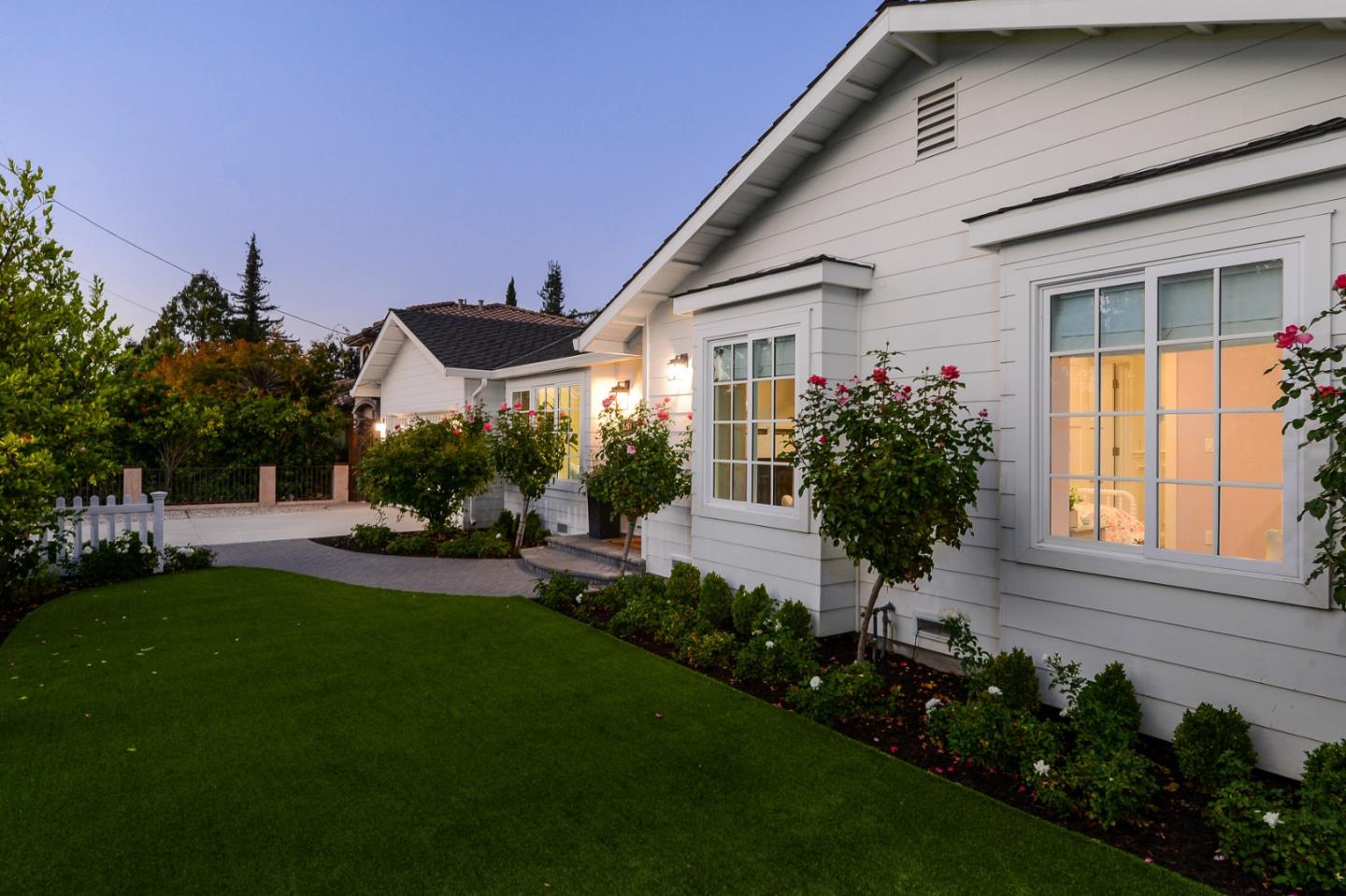 1261 Springer Road Los Altos, CA 94024 - Photo 6 of 32 a front view of a house with a garden and plants