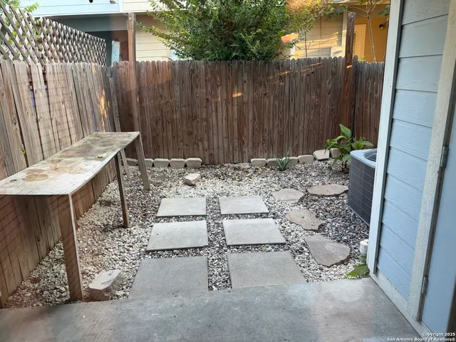 a view of a dinning table and chairs in the patio