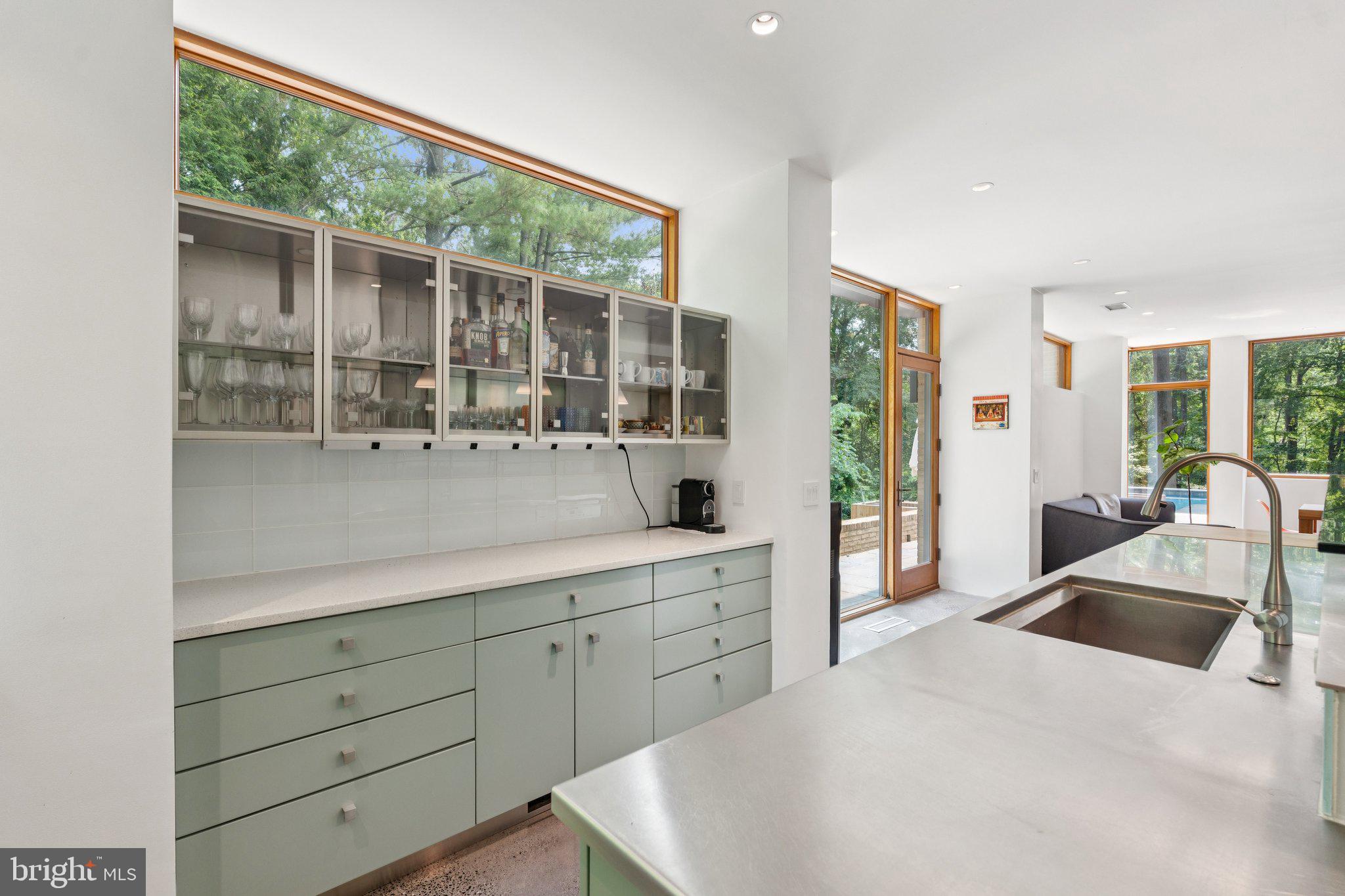 400 Chain Bridge Road McLean, VA 22101 - Photo 11 of 30 a kitchen with sink and large window