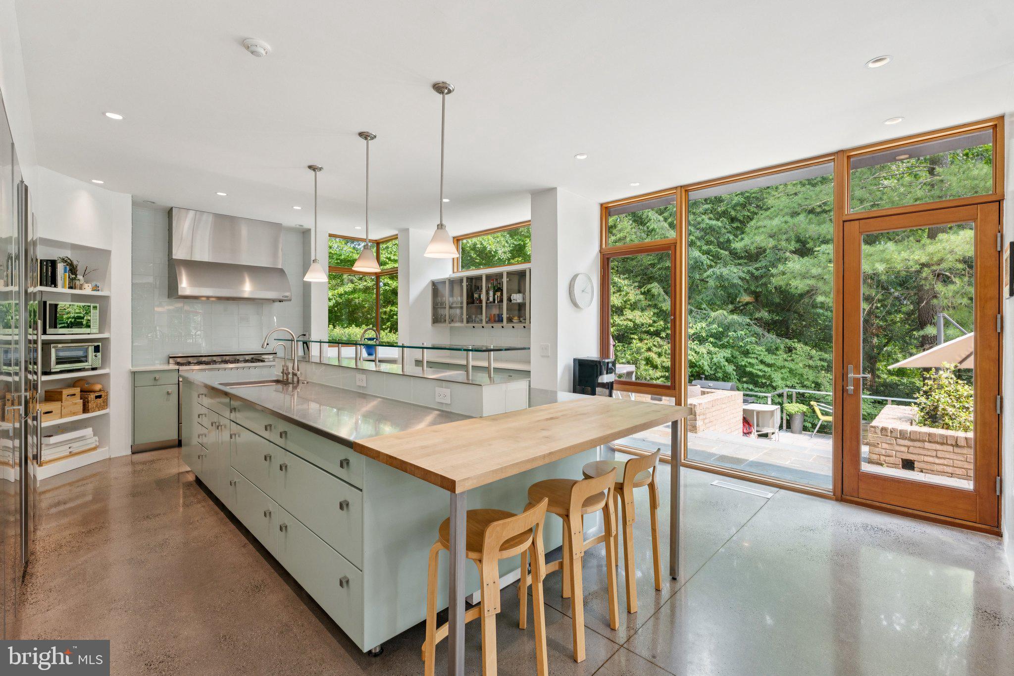 400 Chain Bridge Road McLean, VA 22101 - Photo 12 of 30 a kitchen with kitchen island a large window in it