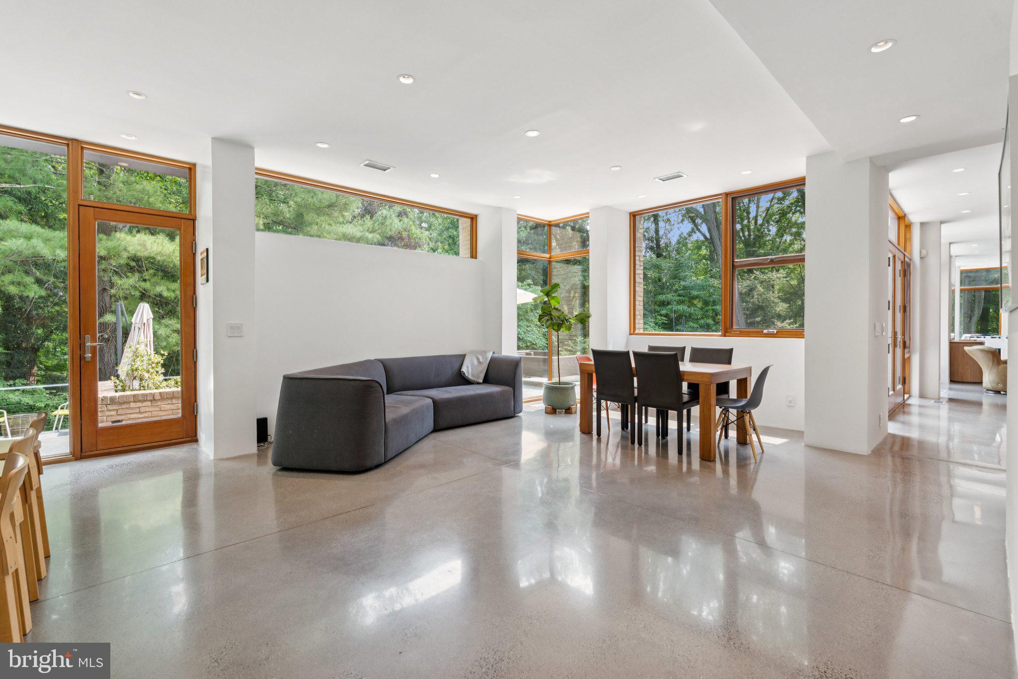 400 Chain Bridge Road McLean, VA 22101 - Photo 14 of 31 a living room with furniture and large windows