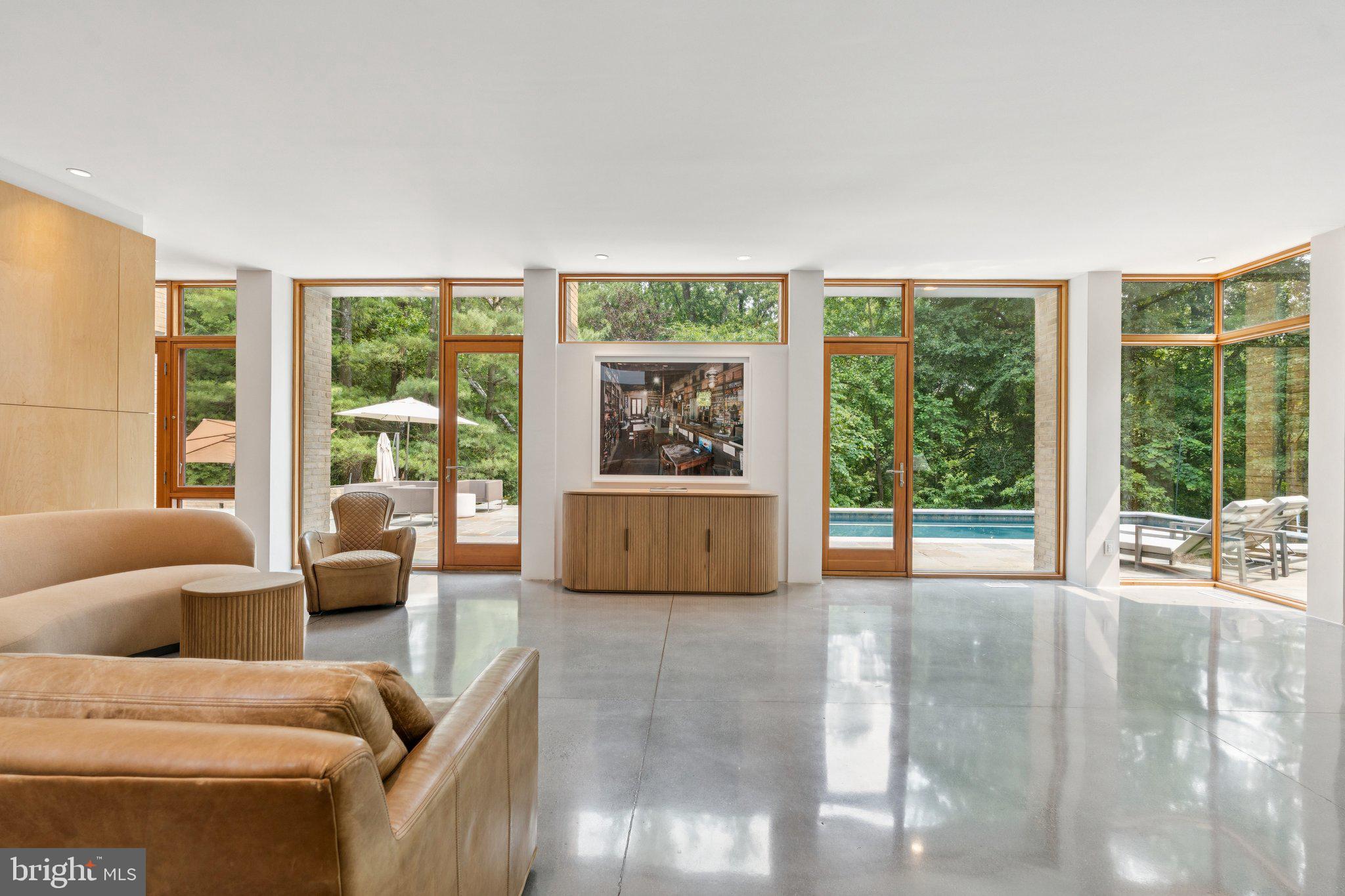 400 Chain Bridge Road McLean, VA 22101 - Photo 19 of 30 a living room with furniture and a large window