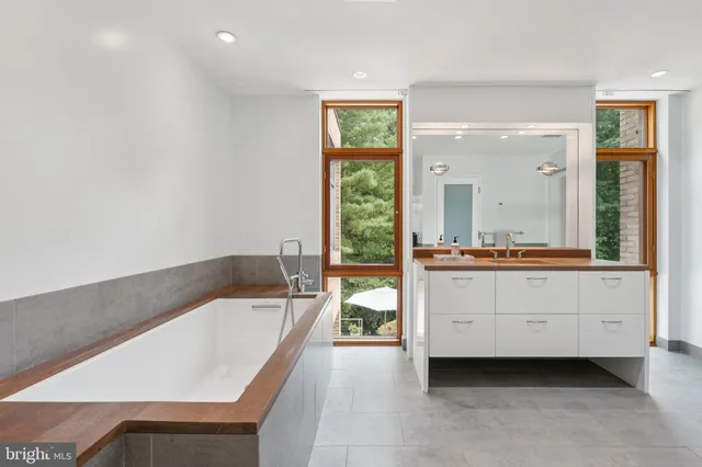 a bathroom with a bathtub and a sink