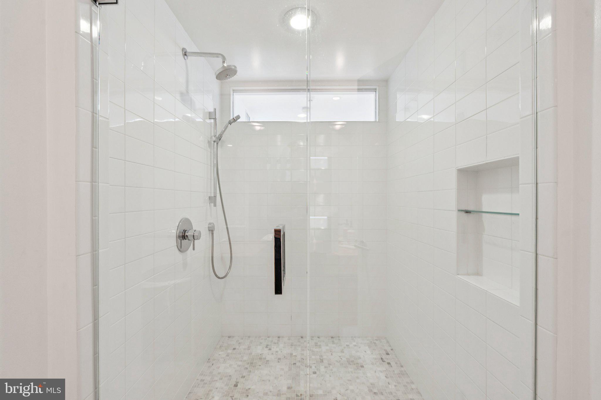 400 Chain Bridge Road McLean, VA 22101 - Photo 23 of 31 a bathroom with a shower