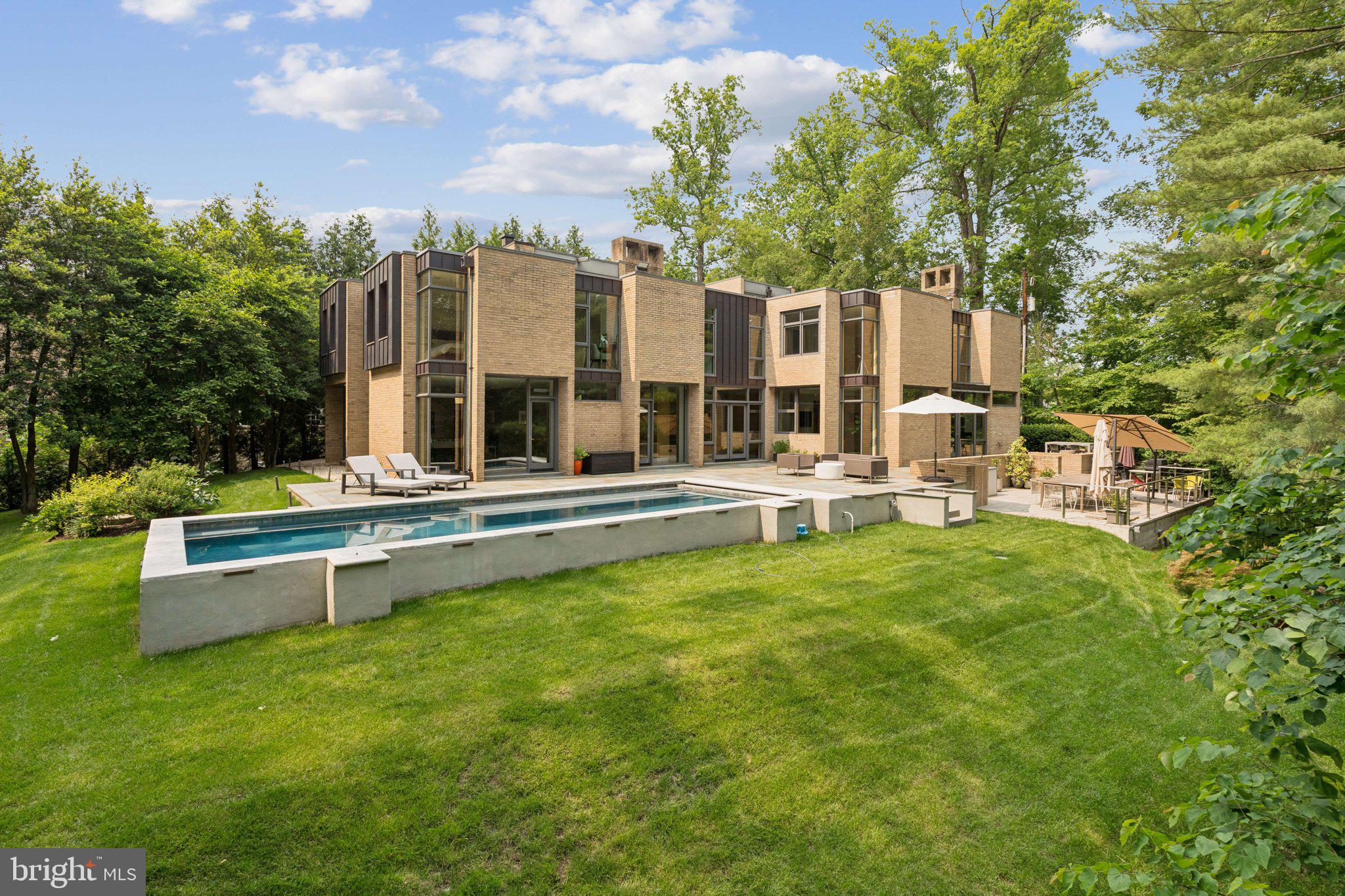 400 Chain Bridge Road McLean, VA 22101 - Photo 25 of 31 a view of a house with swimming pool and porch with furniture