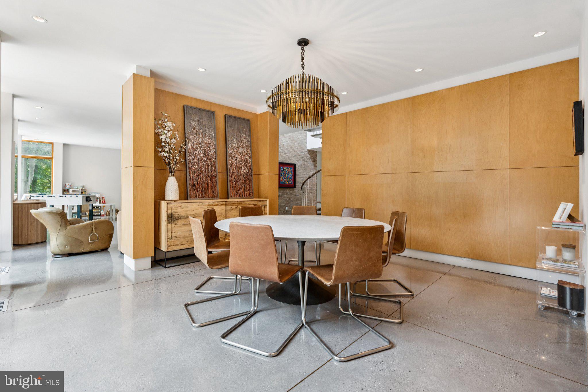 400 Chain Bridge Road McLean, VA 22101 - Photo 8 of 31 a view of a dining room with furniture and a chandelier
