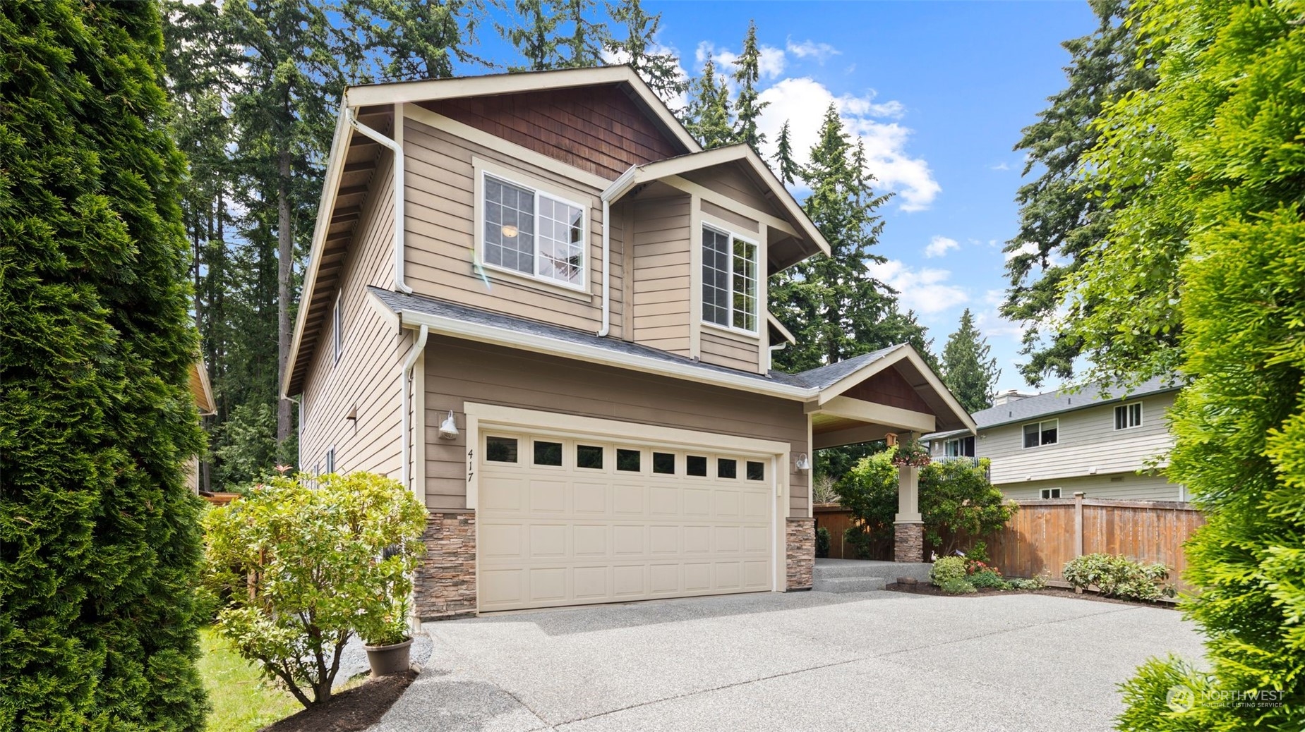 417 196th Street Southeast Bothell, WA 98012 - Photo 1 of 40 a front view of a house with a garage