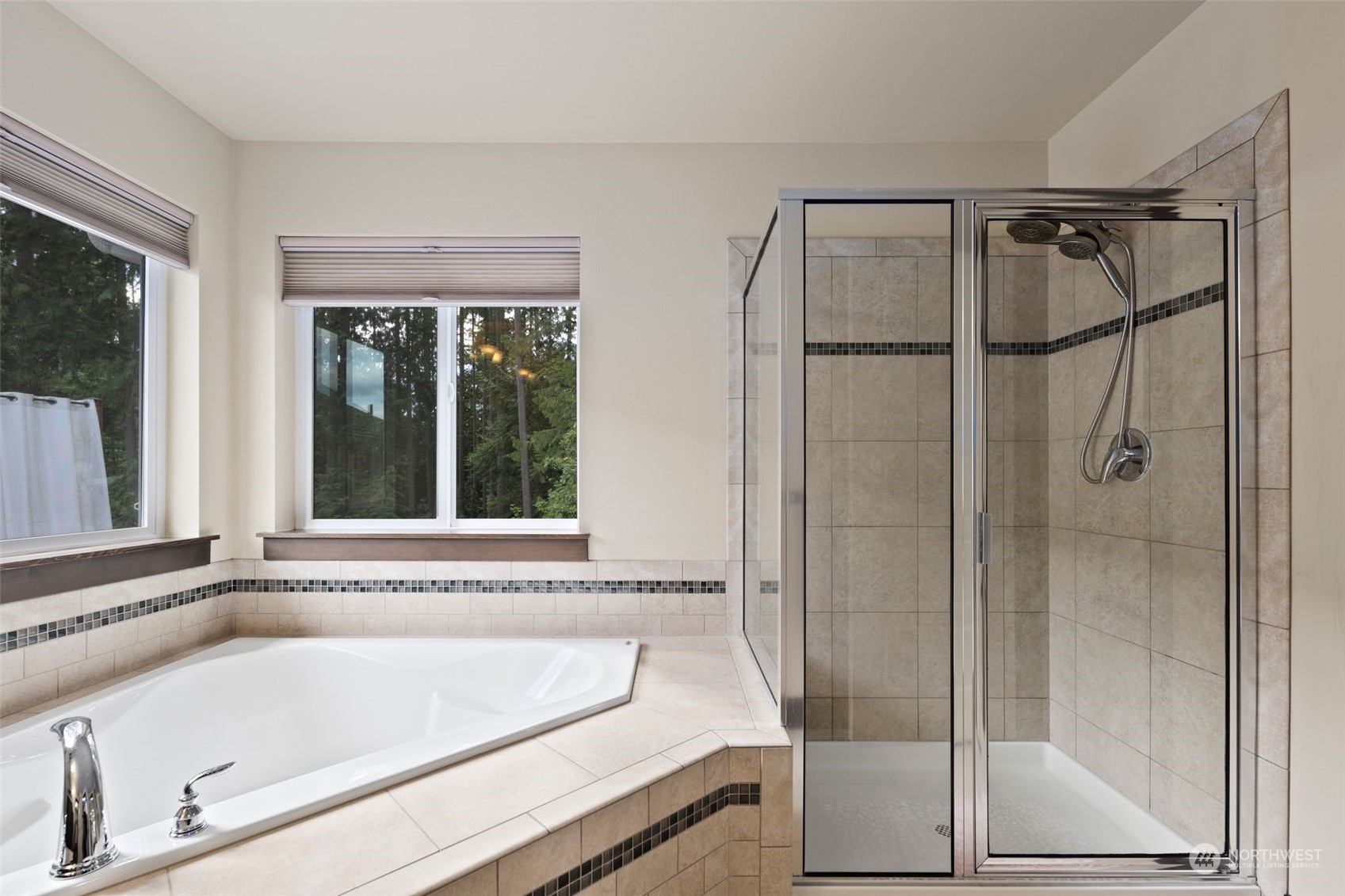 417 196th Street Southeast Bothell, WA 98012 - Photo 23 of 40 a bathroom with a tub and a shower
