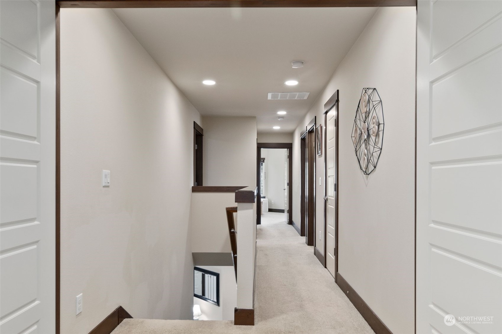 417 196th Street Southeast Bothell, WA 98012 - Photo 24 of 40 a hallway with sliding door and stairs