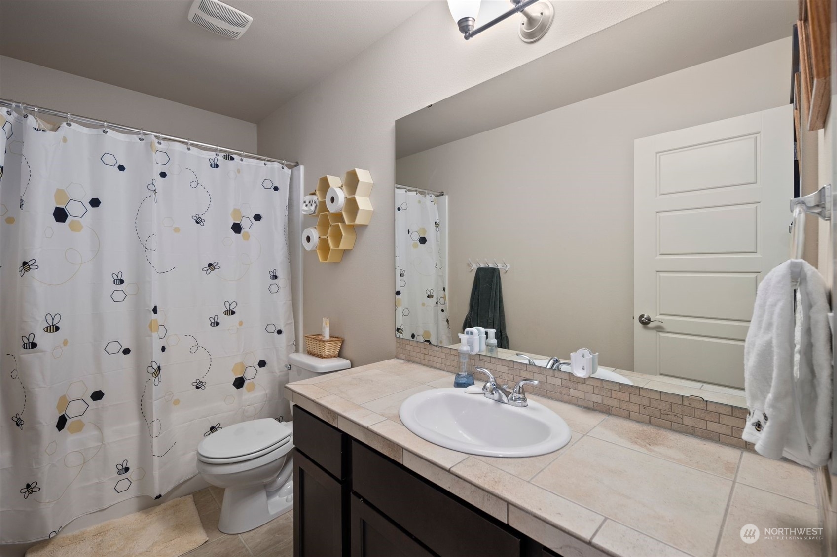 417 196th Street Southeast Bothell, WA 98012 - Photo 29 of 40 a bathroom with a granite countertop sink toilet and shower