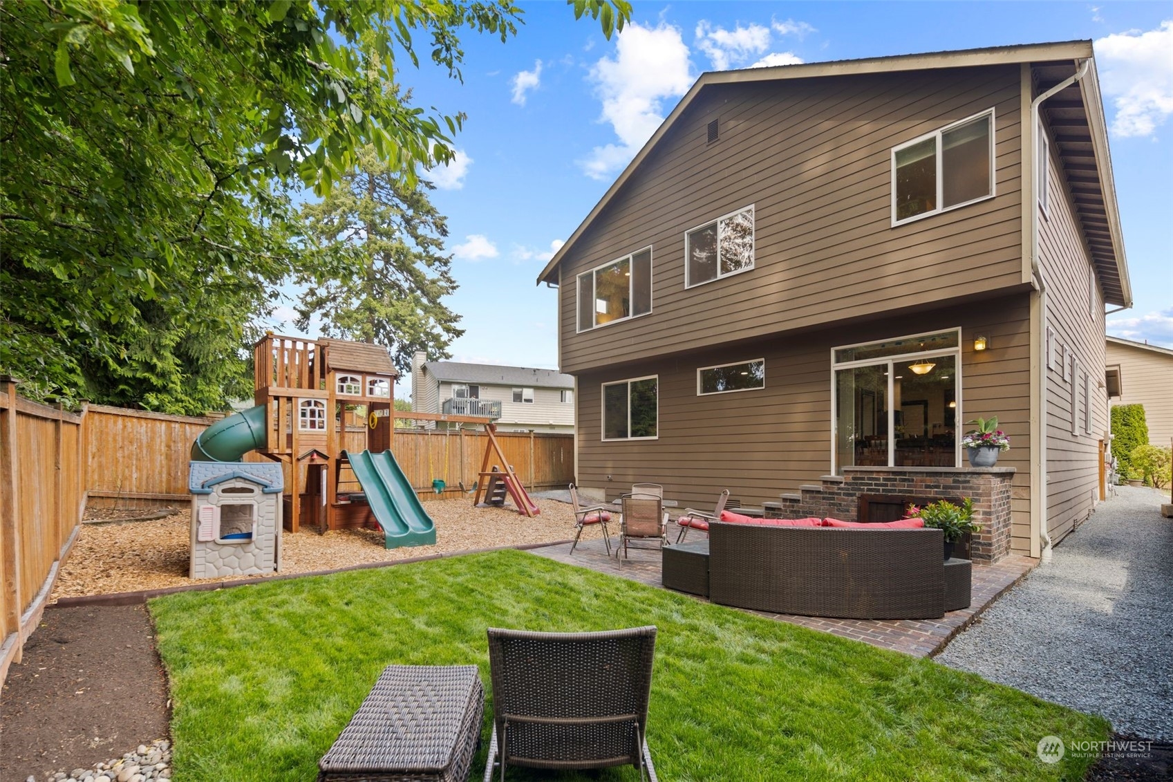 417 196th Street Southeast Bothell, WA 98012 - Photo 34 of 40 a front view of a house with swing and wooden fence