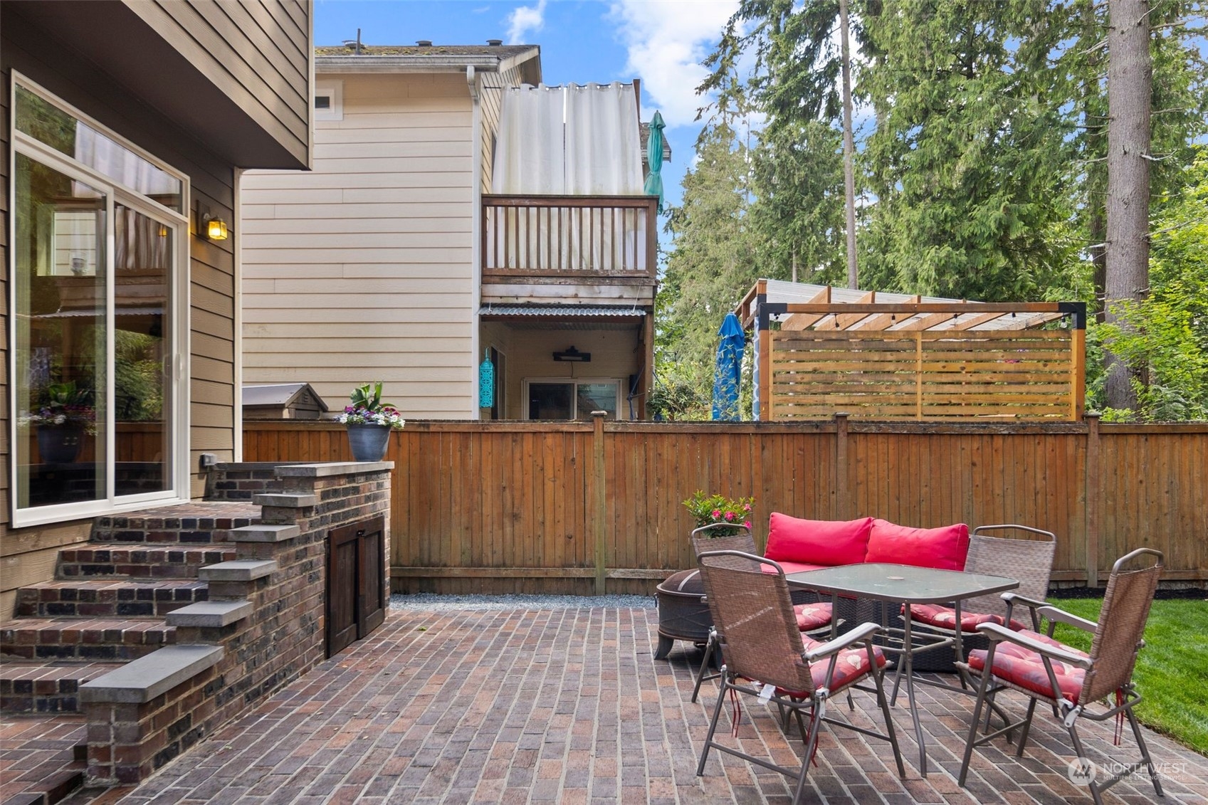 417 196th Street Southeast Bothell, WA 98012 - Photo 35 of 40 a view of a patio with table and chairs with wooden floor and fence