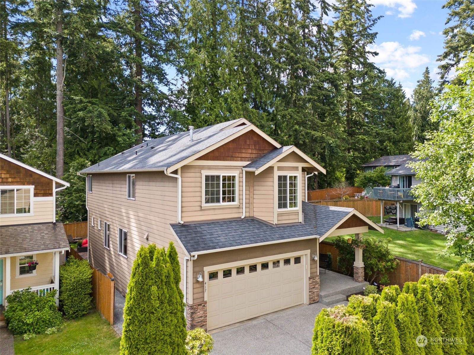 417 196th Street Southeast Bothell, WA 98012 - Photo 37 of 40 a view of house with a yard and potted plants