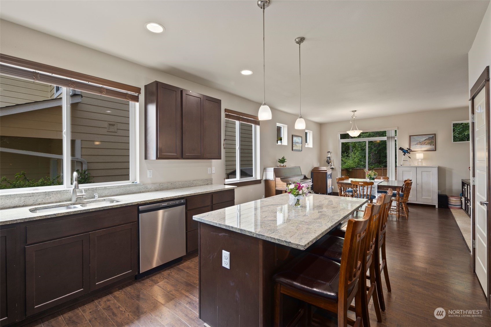 417 196th Street Southeast Bothell, WA 98012 - Photo 9 of 40 a kitchen with center island table and chairs in it