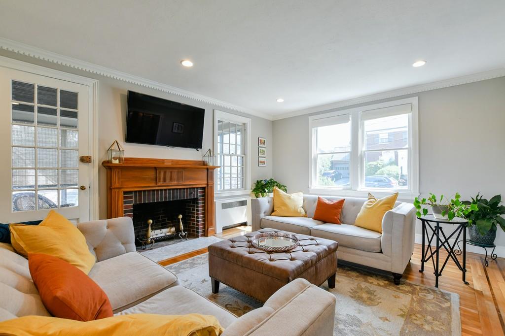 9 Hillcroft Road Boston, MA 02130 - Photo 13 of 29 a living room with furniture flat screen tv and a fireplace