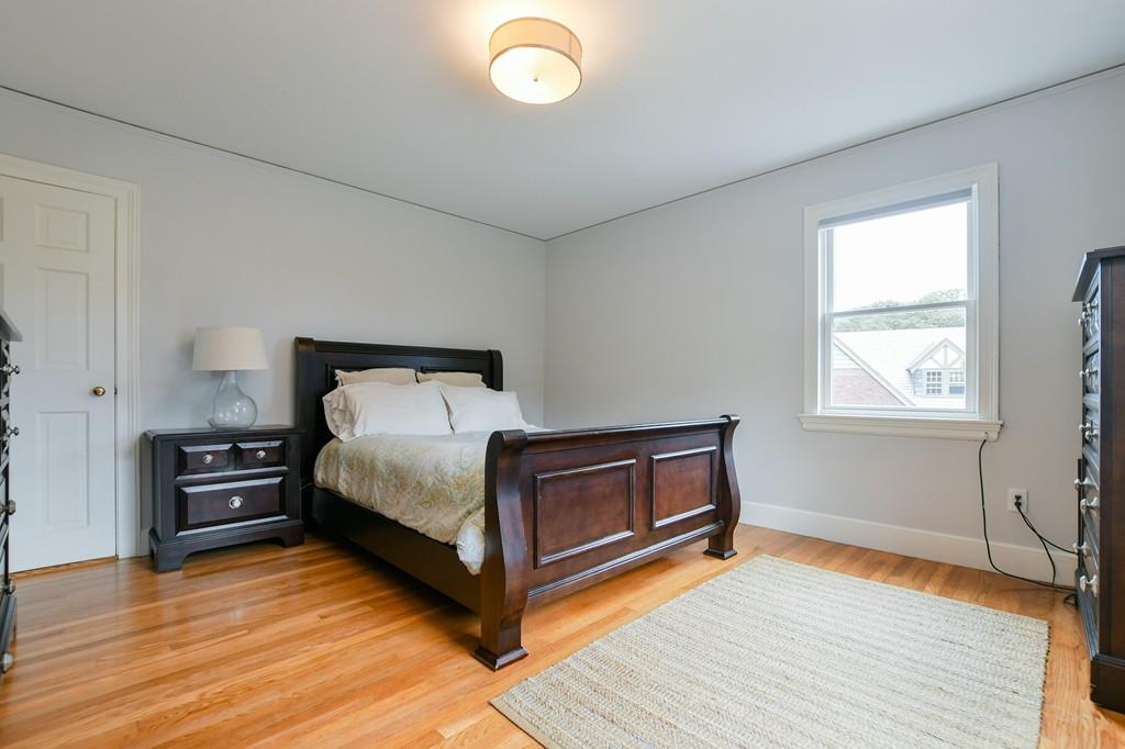 9 Hillcroft Road Boston, MA 02130 - Photo 18 of 29 a bedroom with a bed and wooden floor