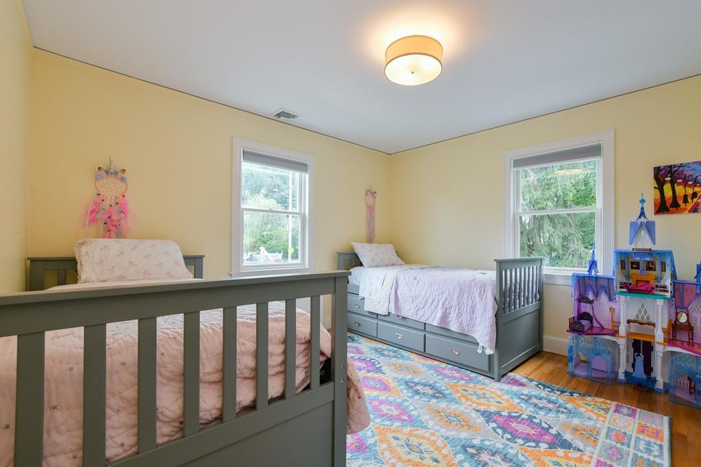 9 Hillcroft Road Boston, MA 02130 - Photo 19 of 29 a bedroom with furniture and a baby crib