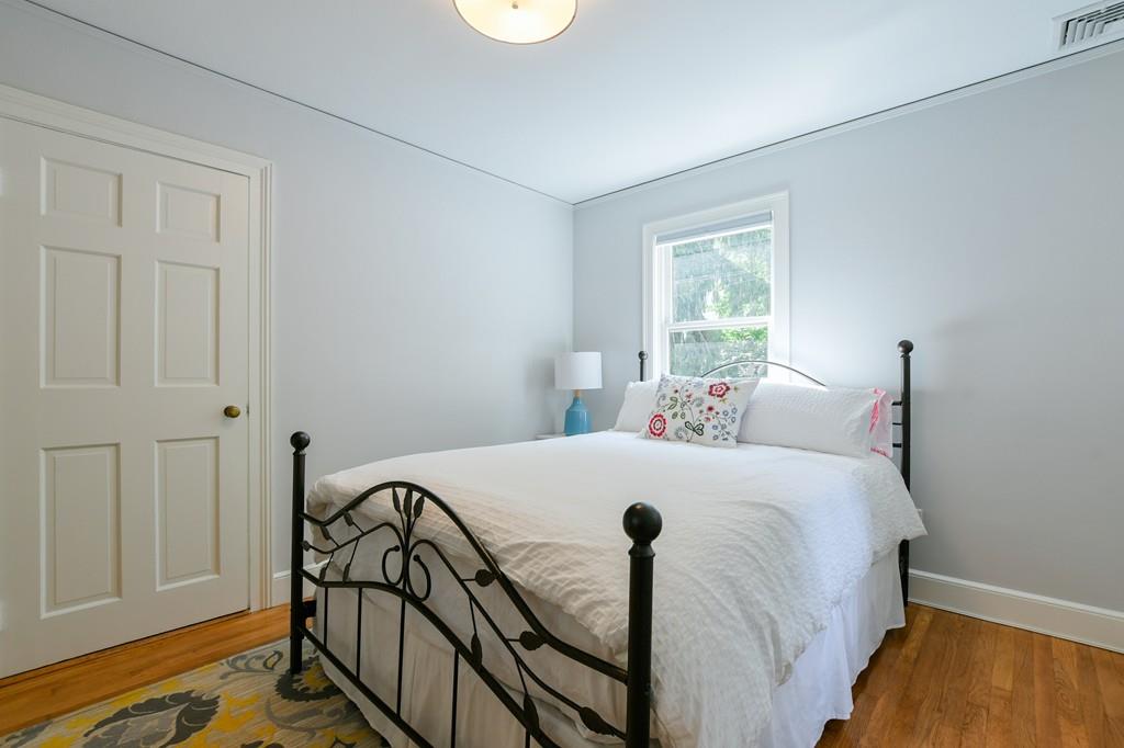9 Hillcroft Road Boston, MA 02130 - Photo 20 of 29 a bedroom with a bed and wooden floor