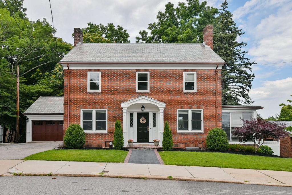 9 Hillcroft Road Boston, MA 02130 - Photo 2 of 29 a front view of a house with a yard and garage