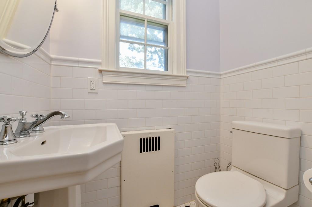9 Hillcroft Road Boston, MA 02130 - Photo 23 of 29 a bathroom with a sink a toilet and a mirror
