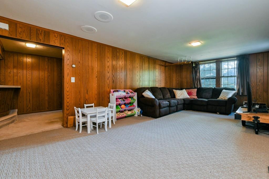 9 Hillcroft Road Boston, MA 02130 - Photo 26 of 29 a living room with furniture a flat screen tv and a window