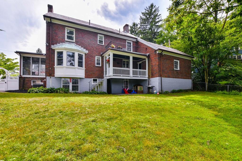 9 Hillcroft Road Boston, MA 02130 - Photo 28 of 29 a front view of a house with a garden