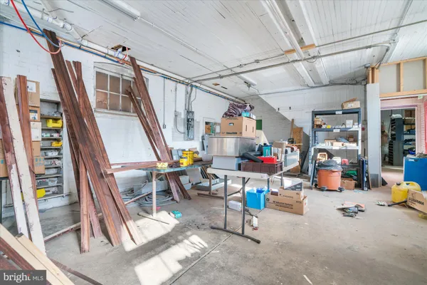 a kitchen with granite countertop white cabinets and a stove