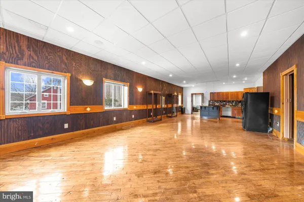 a view of room with window and wooden floor