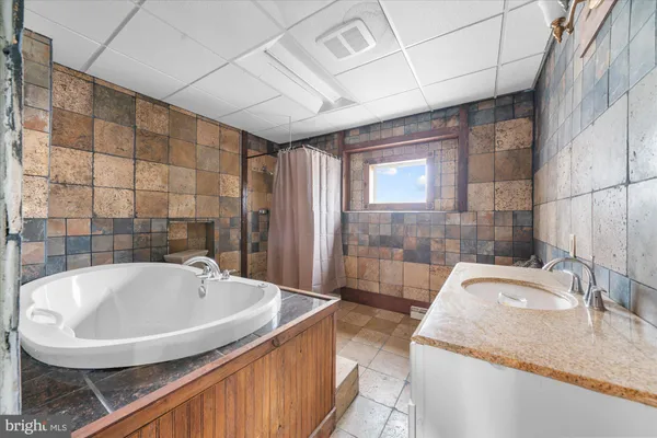 a view of empty room with wooden ceiling