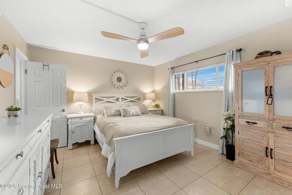 a bedroom with a bed and a view of closet