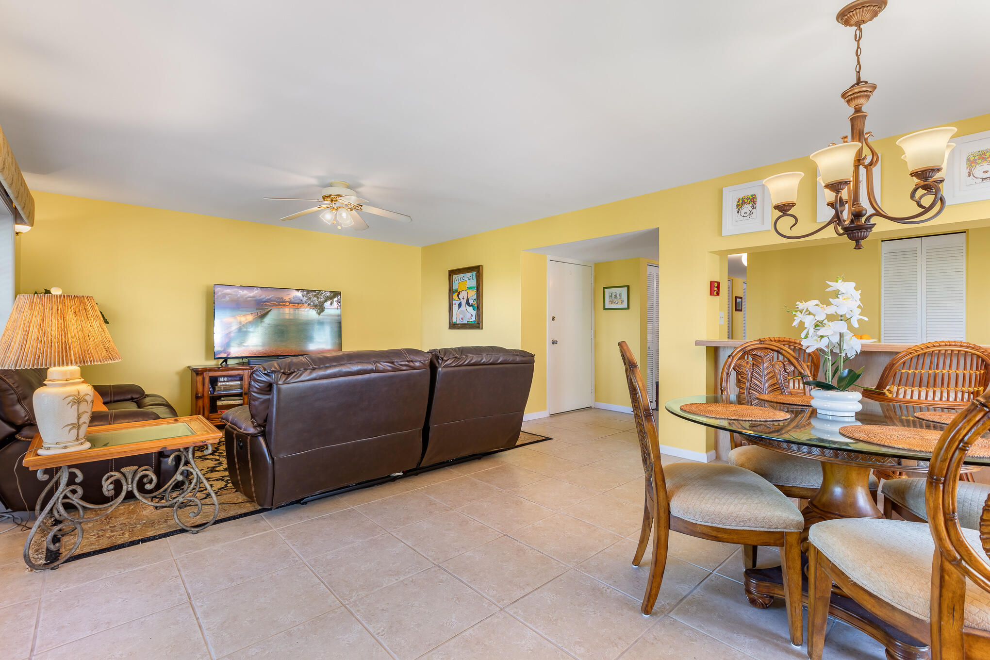 30 Hilton Haven Road, Unit 2A Key West, FL 33040 - Photo 13 of 36 a bedroom with a bed and chair