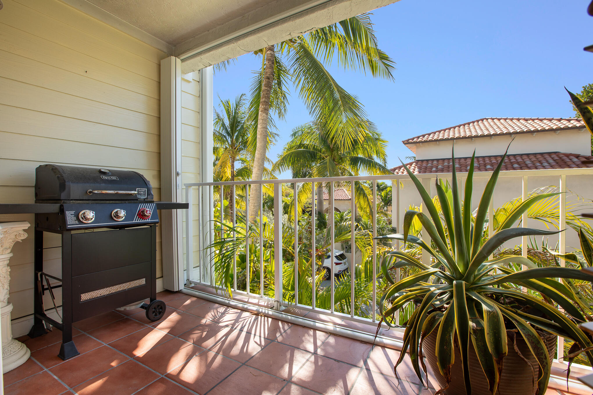 30 Hilton Haven Road, Unit 2A Key West, FL 33040 - Photo 14 of 36 a view of a house with a window and a potted plant
