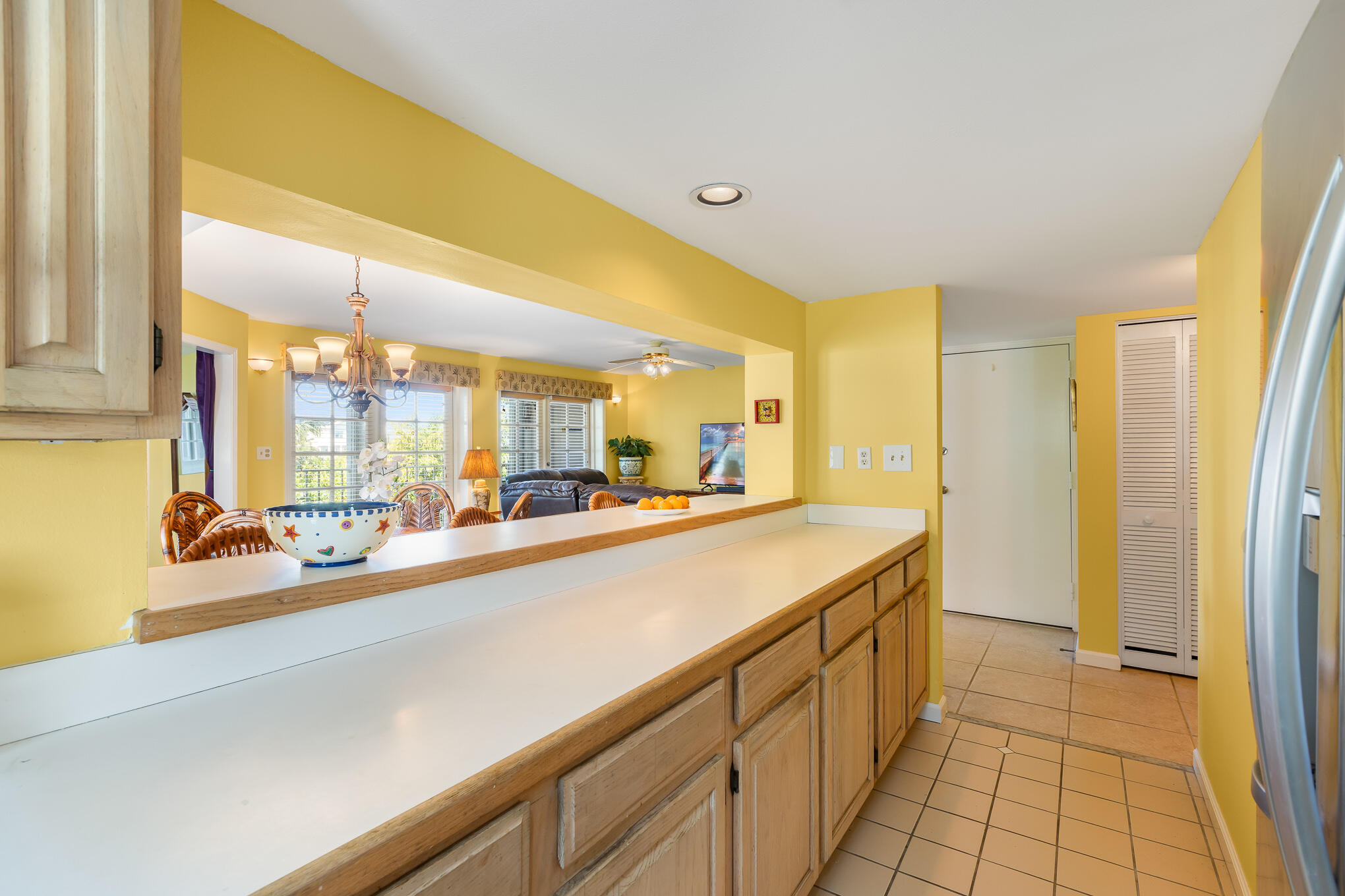 30 Hilton Haven Road, Unit 2A Key West, FL 33040 - Photo 9 of 36 a view of a kitchen with a sink and large window
