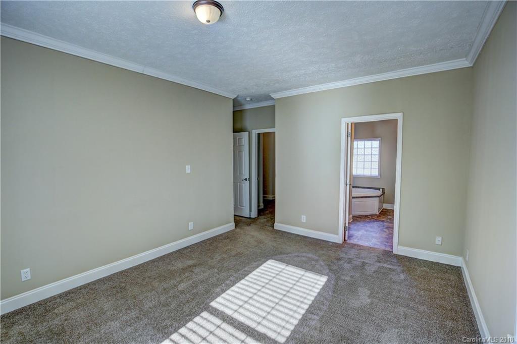2006 Long Hope Road Monroe, NC 28112 - Photo 16 of 34 an empty room with closet and a window