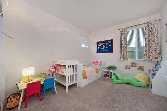 a bedroom with furniture a bed and a window