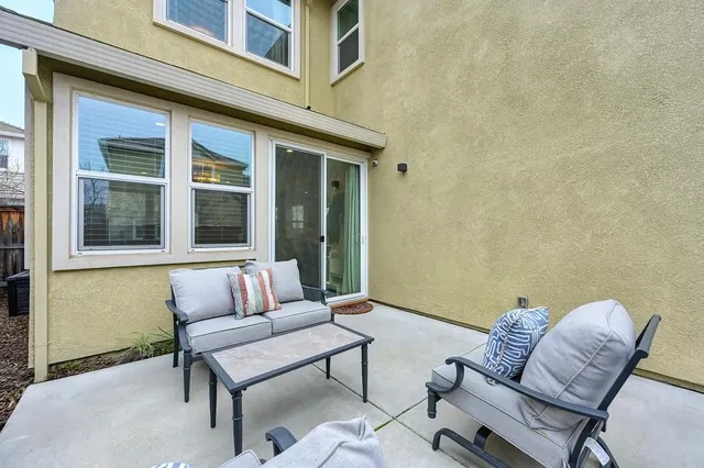 a outdoor living area with furniture and a window