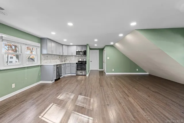 a view of kitchen with cabinets and wooden floor