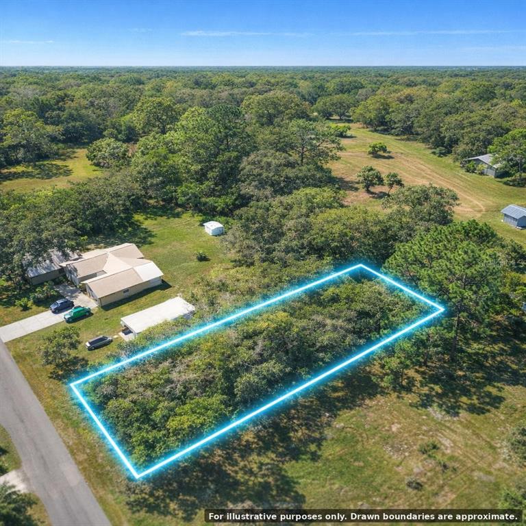 Flamingo Road Oak Hill, FL 32759 - Photo 5 of 14 a view of a yard with wooden fence